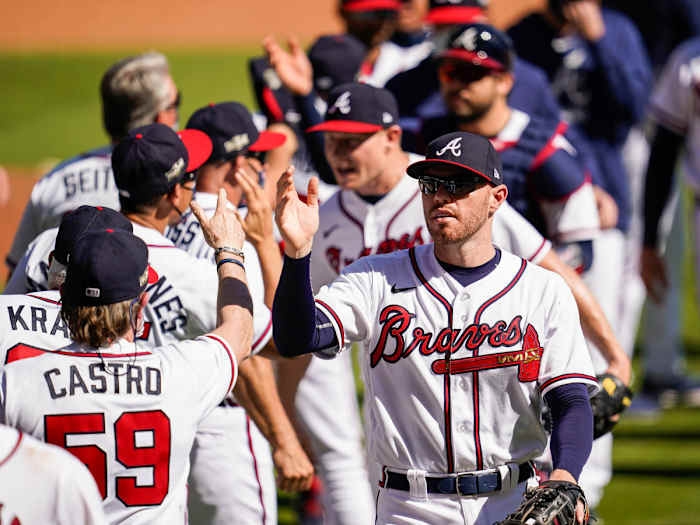 Braves celebrate after beating Reds